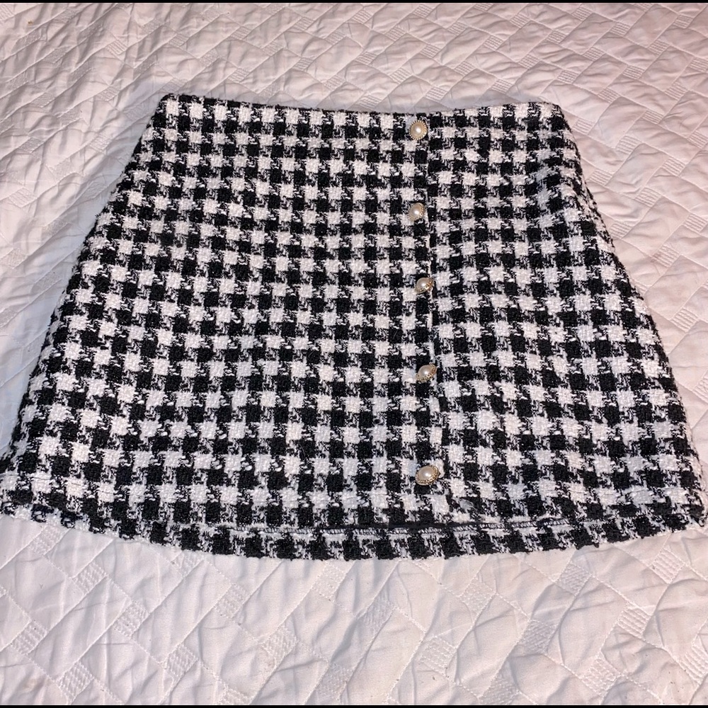 black and white patterned skirt with gold/pearl pendants/faux buttons